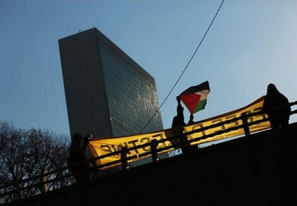 palestine flag in front of Un building